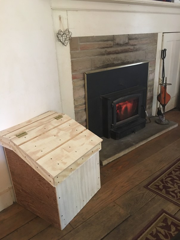 Wood box by fireplace